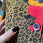 Blusa animalier e fiori